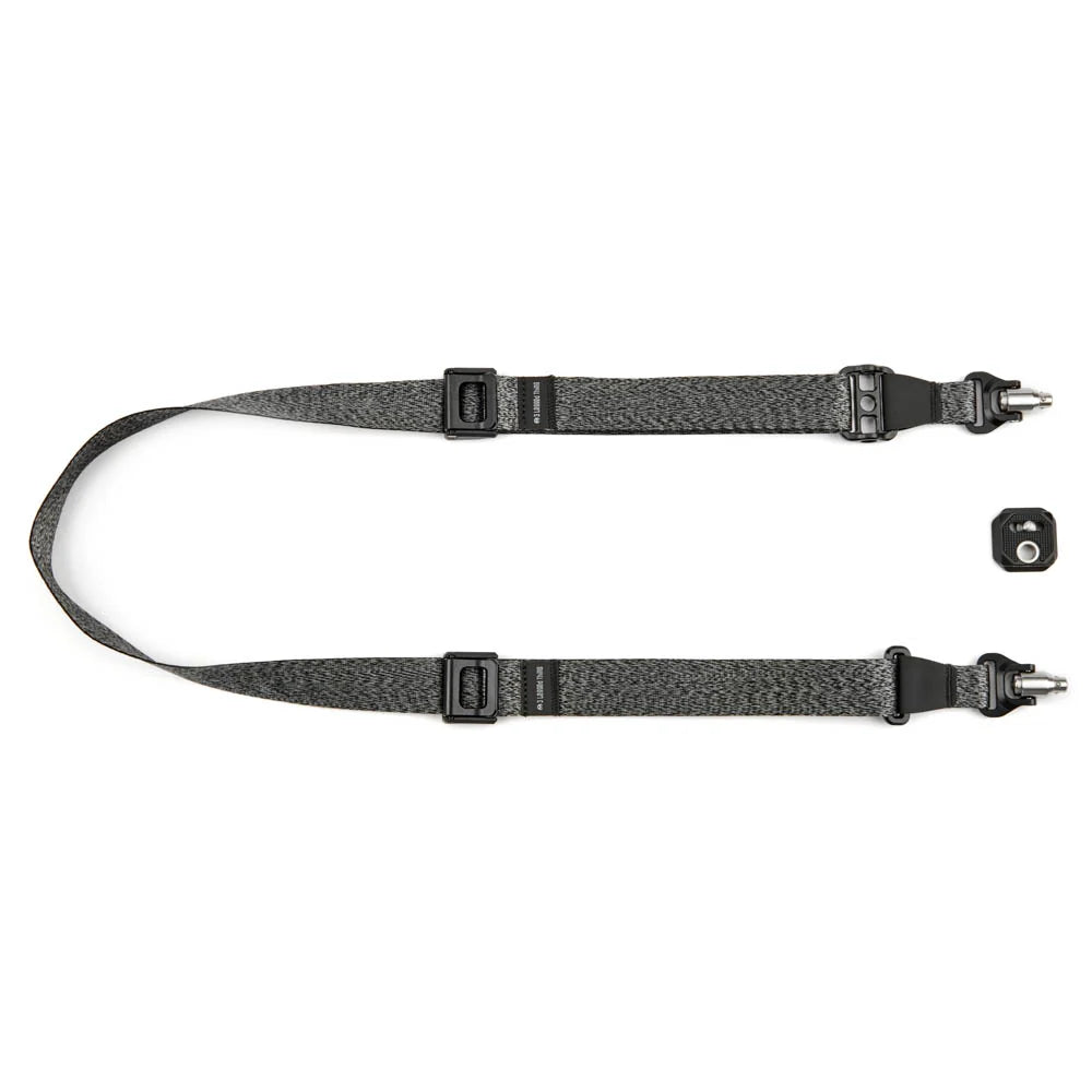 Black camera strap with quick-release mechanism on a white background