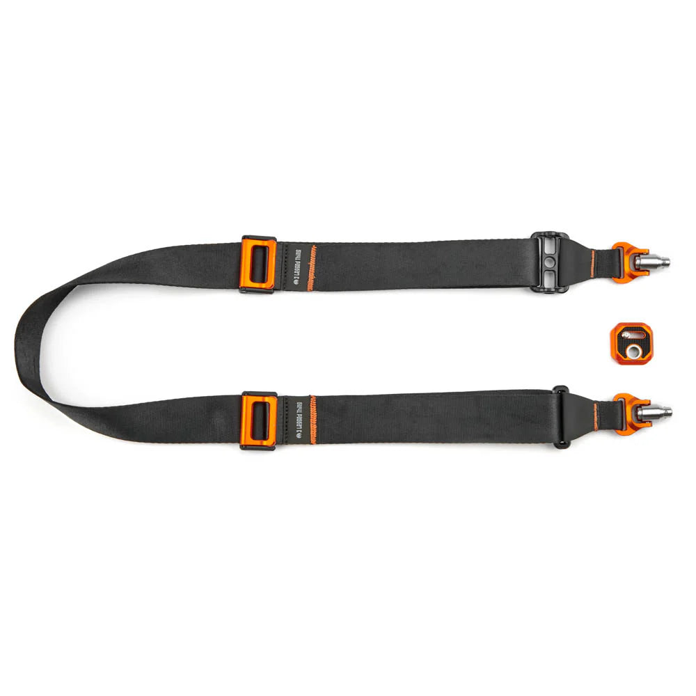 Black camera strap with orange fasteners on a white background