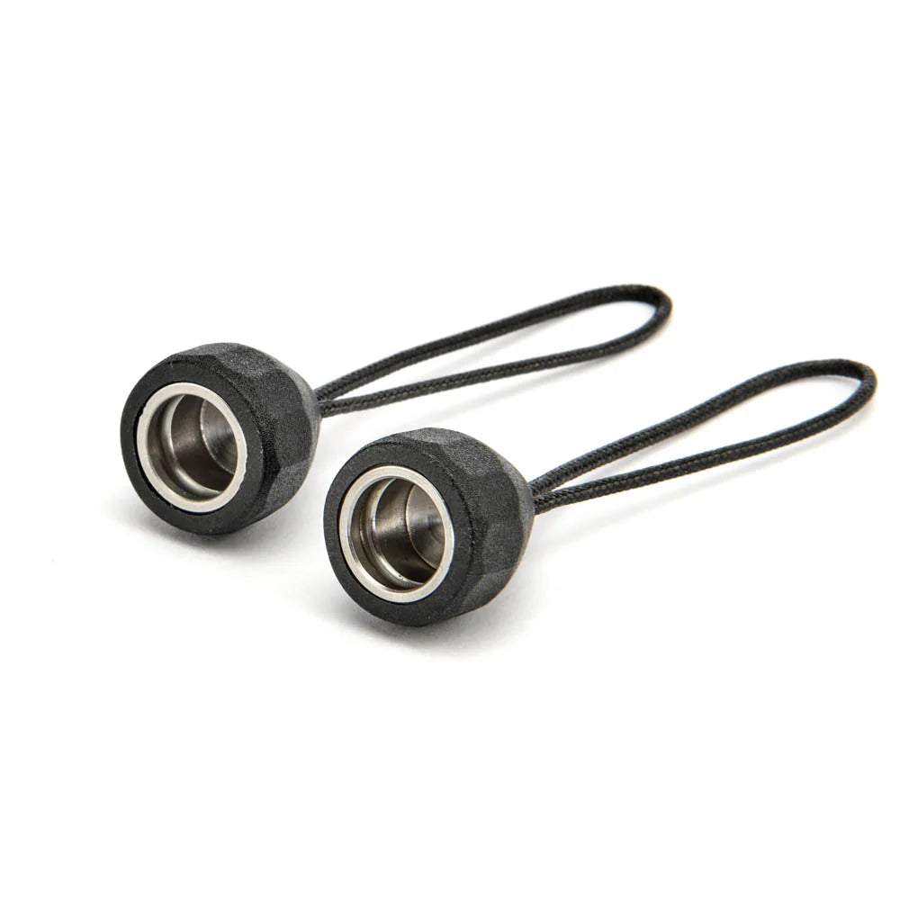 Two black quick detach lug adaptors on a white background