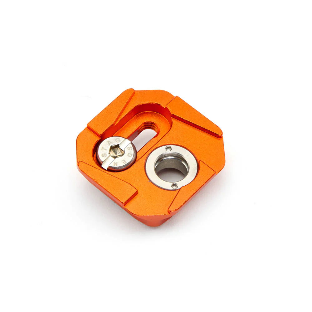 Orange metal hexagonal tripod plate on a white background