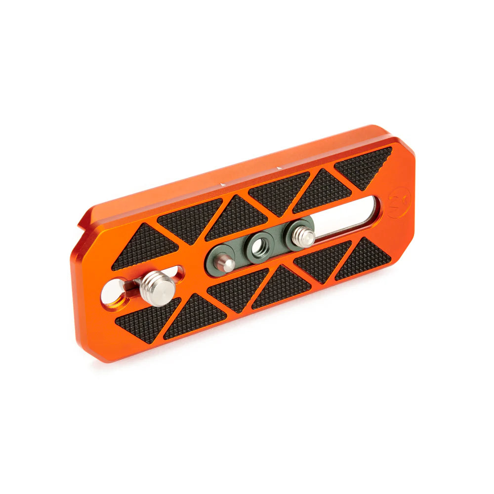 Orange metal tripod plate with black textured surface on a white background