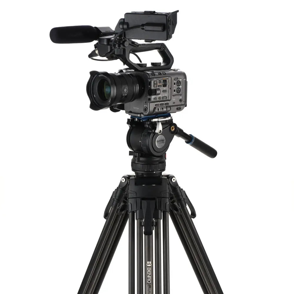 Professional video camera on a tripod with a white background
