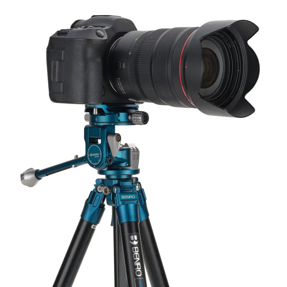 Camera on a tripod with a white background