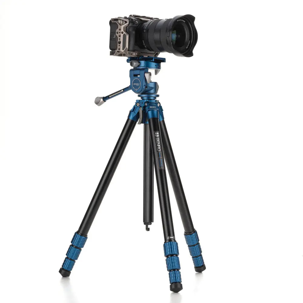 Camera on a tripod with a white background