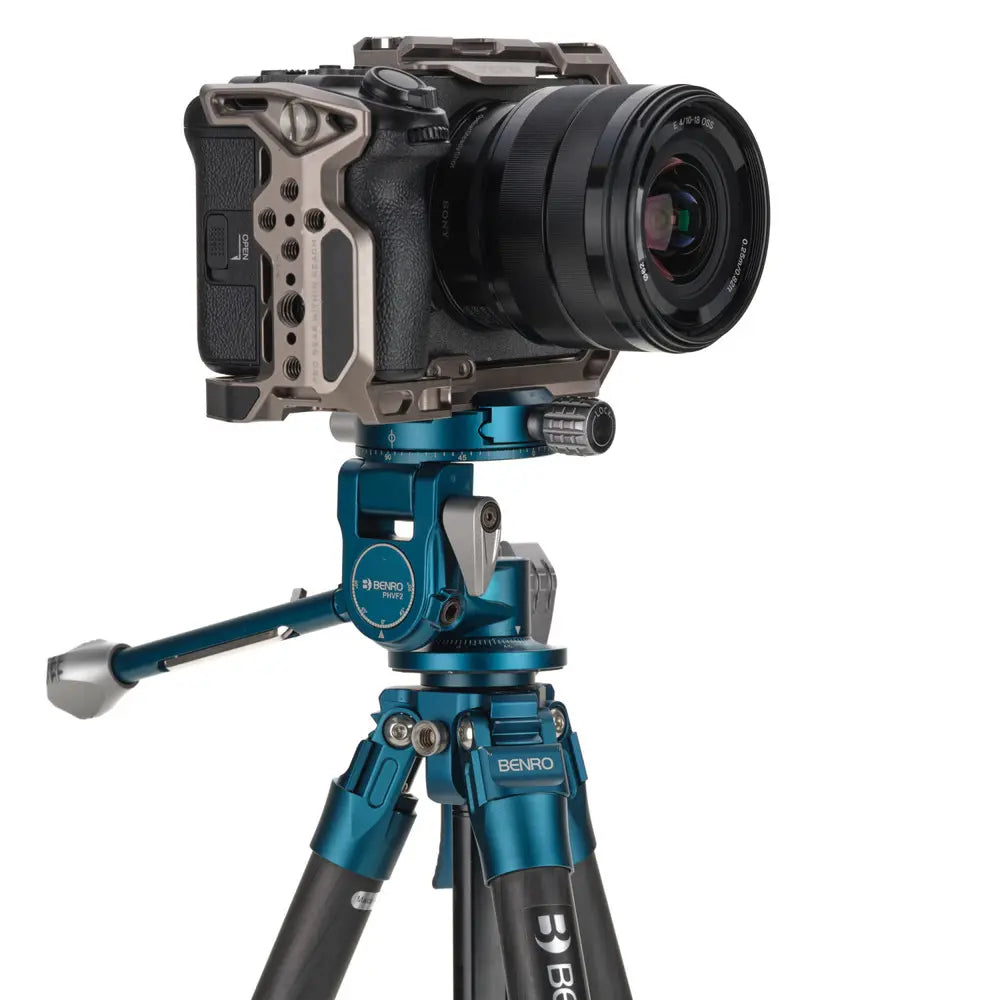 Camera on a Benro tripod with a white background
