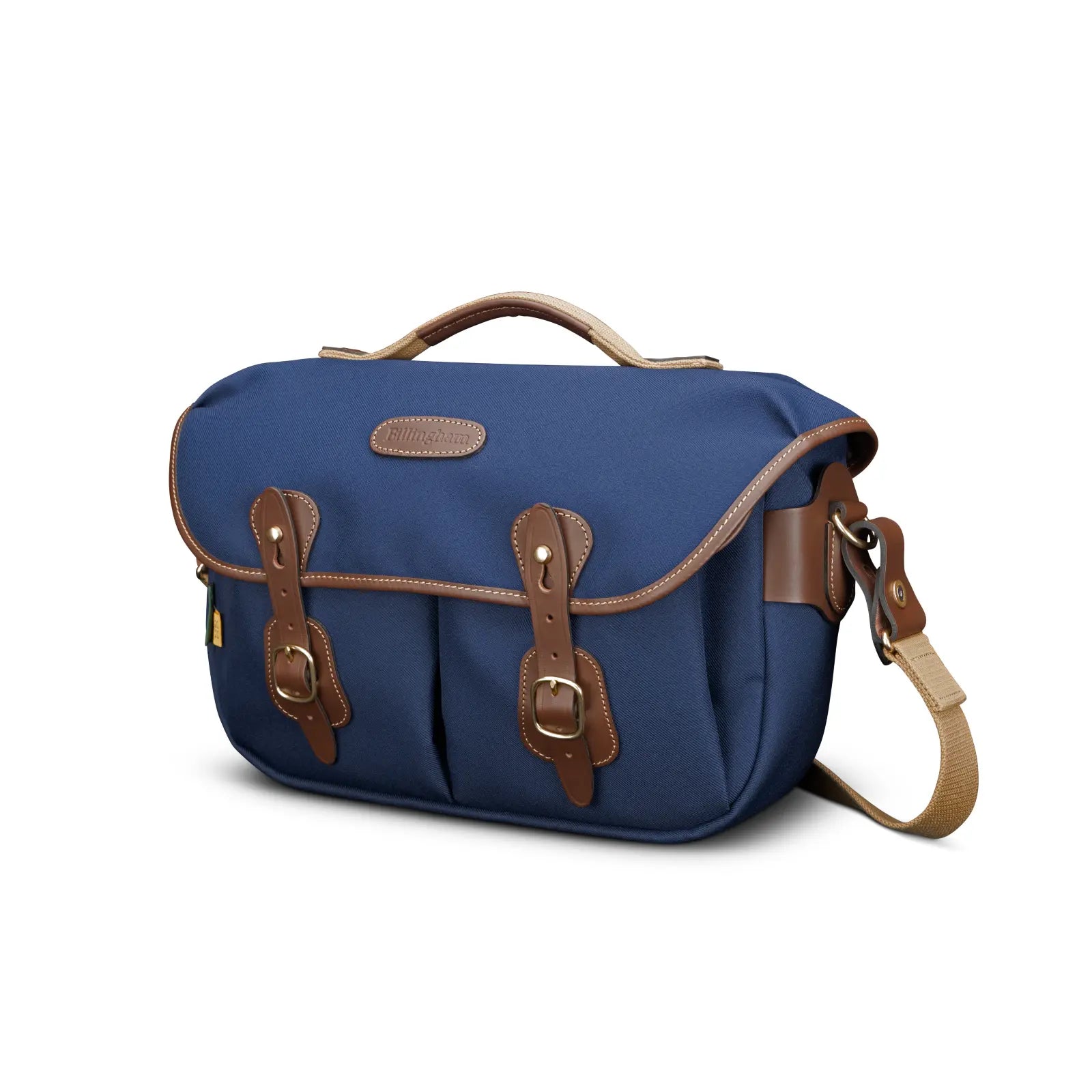 Blue bag with brown leather straps and accents on a white background
