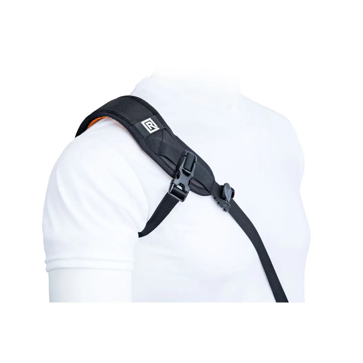 Black shoulder harness worn by a person on a white background