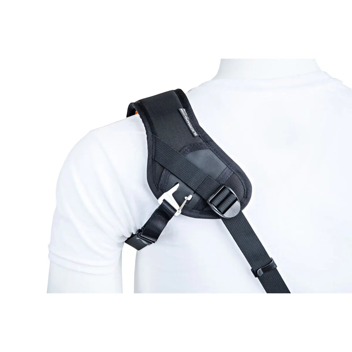Black shoulder harness worn by a person on a white background