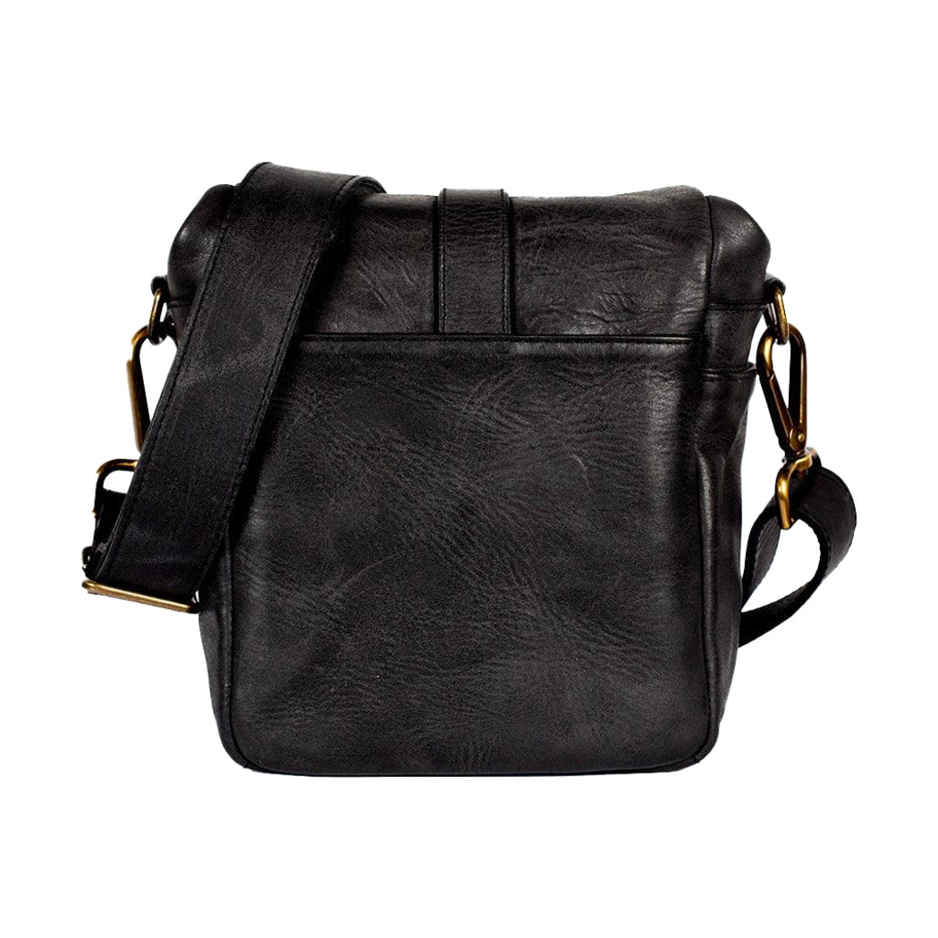 Black leather bag with gold accents on a white background