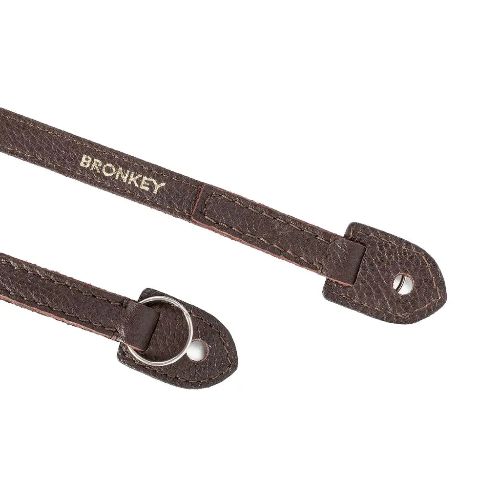 Brown leather strap with bronkey branding on a white background