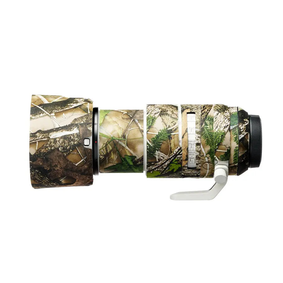 Camouflage-patterned camera lens on a white background