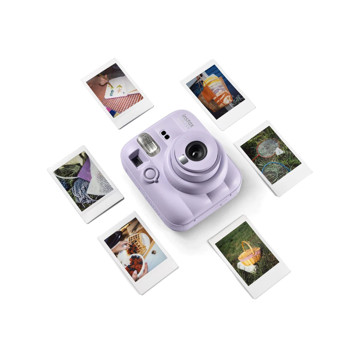 Lilac instant camera with instant photos on a white background