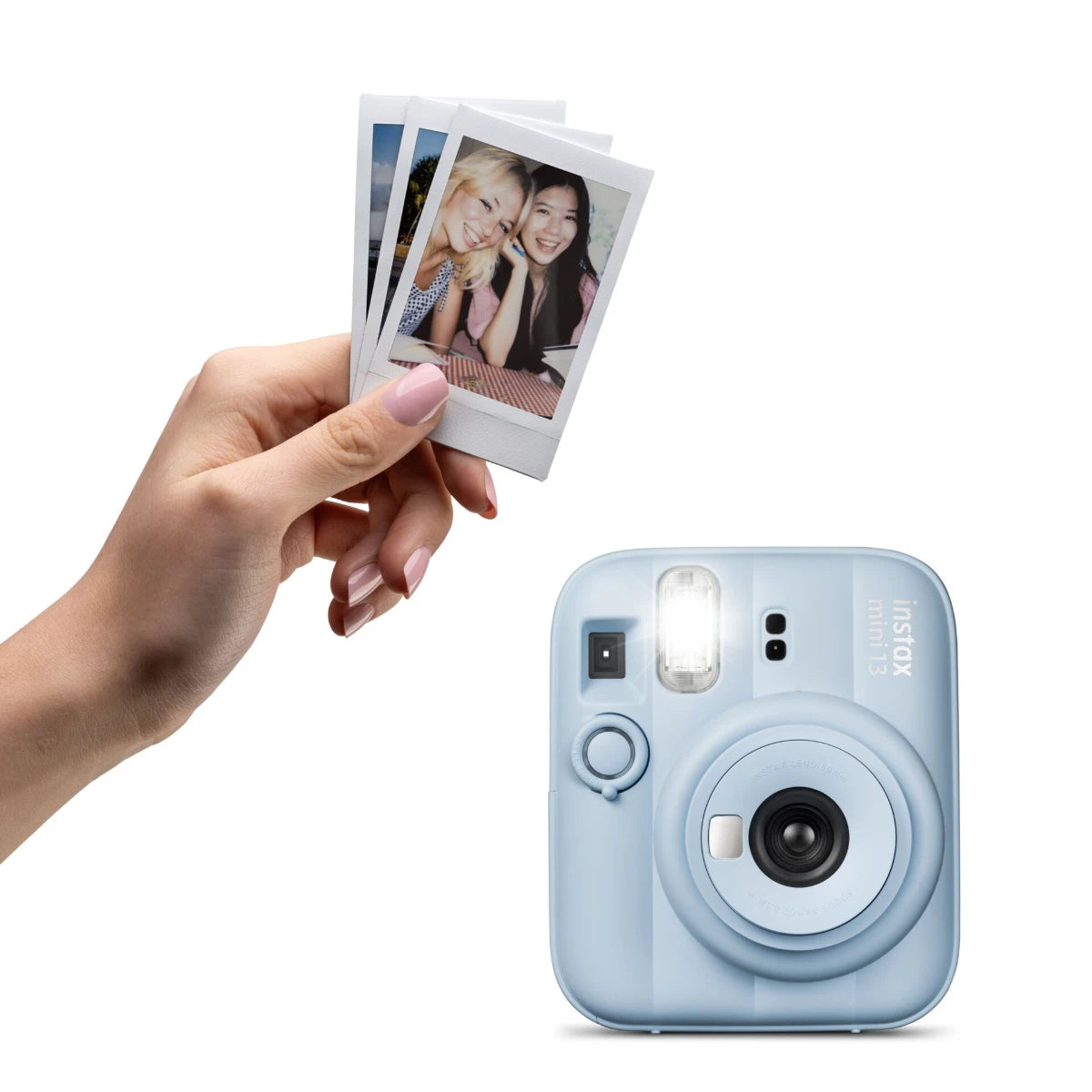 Blue instant camera with a hand holding photos on a white background
