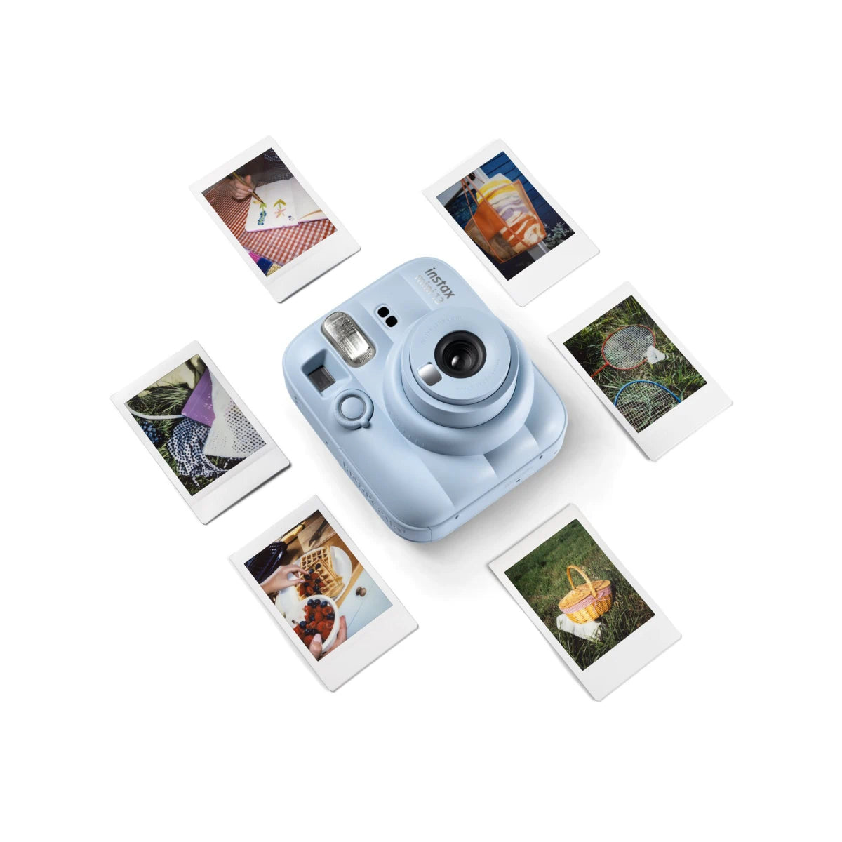 Blue instant camera with instant photos on a white background