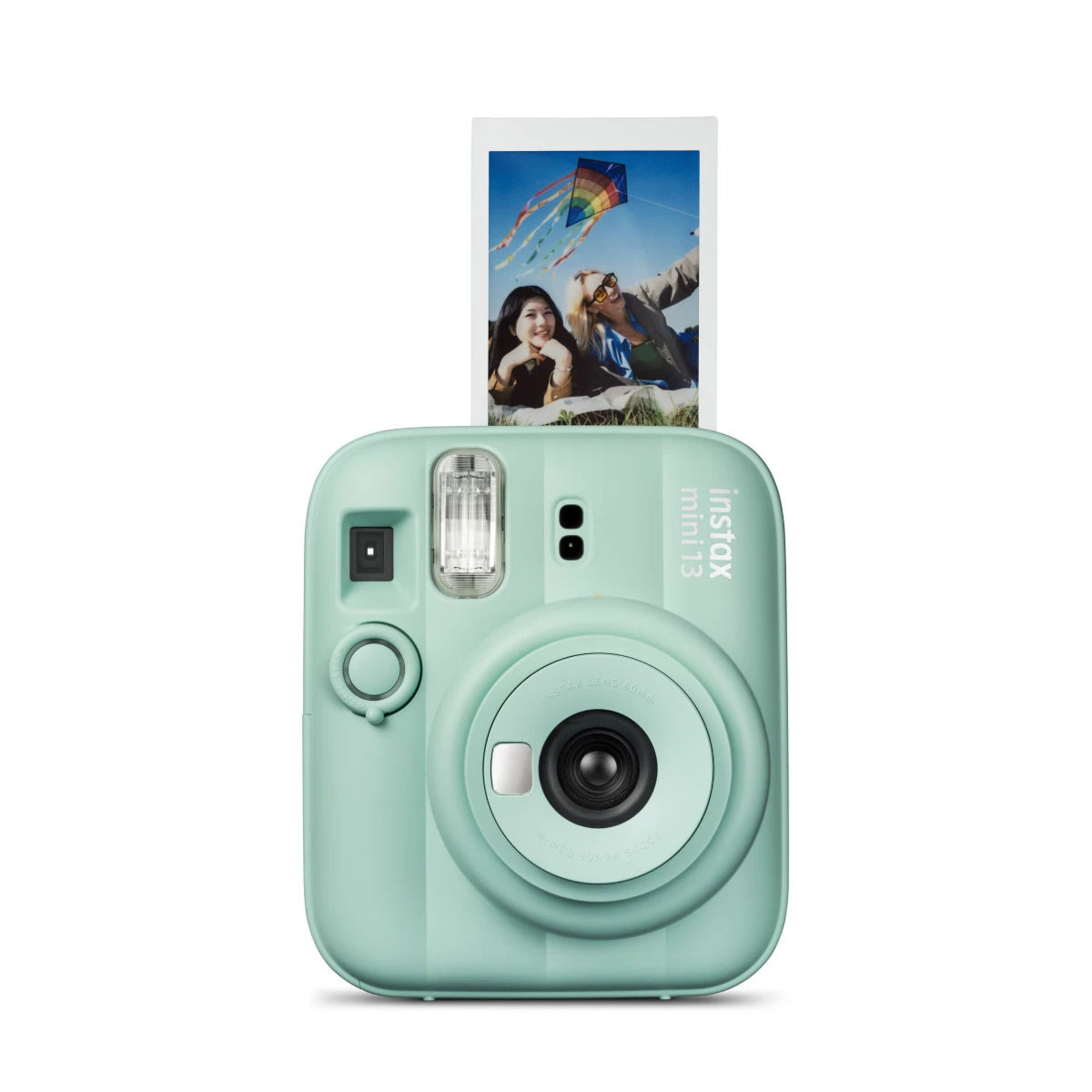Mint green instant camera with a photo print on a white background