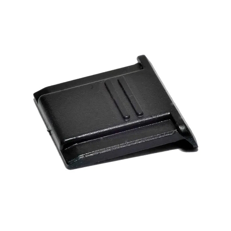 Black plastic component on a white background