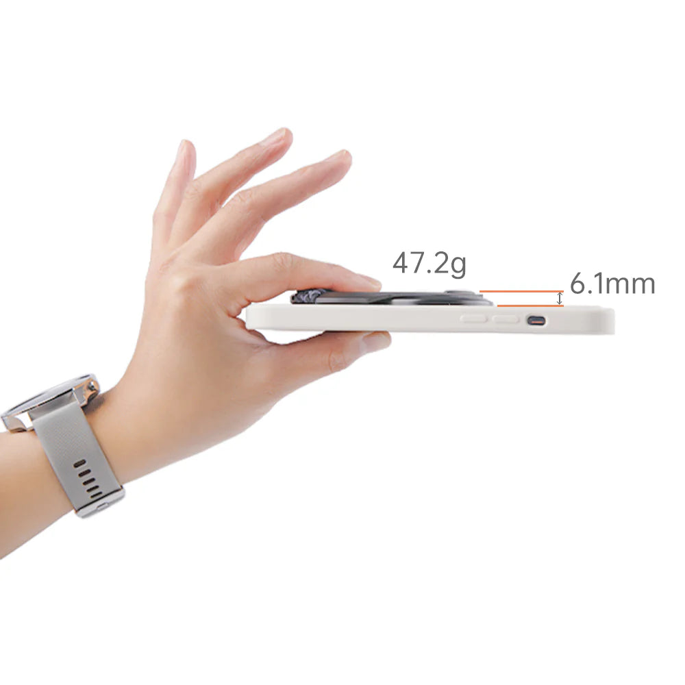 Hand holding a smartphone with a close-up of its thinness and weight on a white background