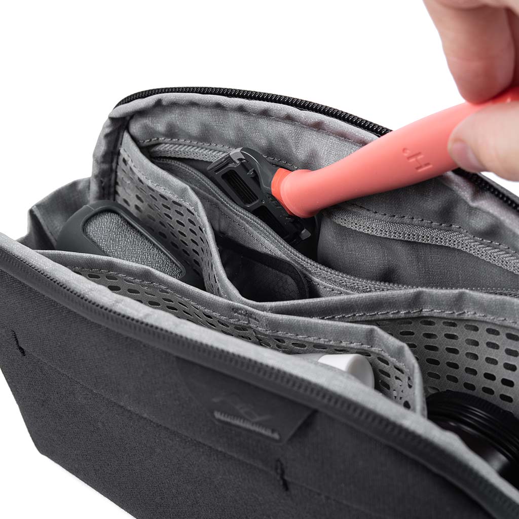 Peak Design Wash Pouch V2 Small – Sage top angle of toothbrush in pouch