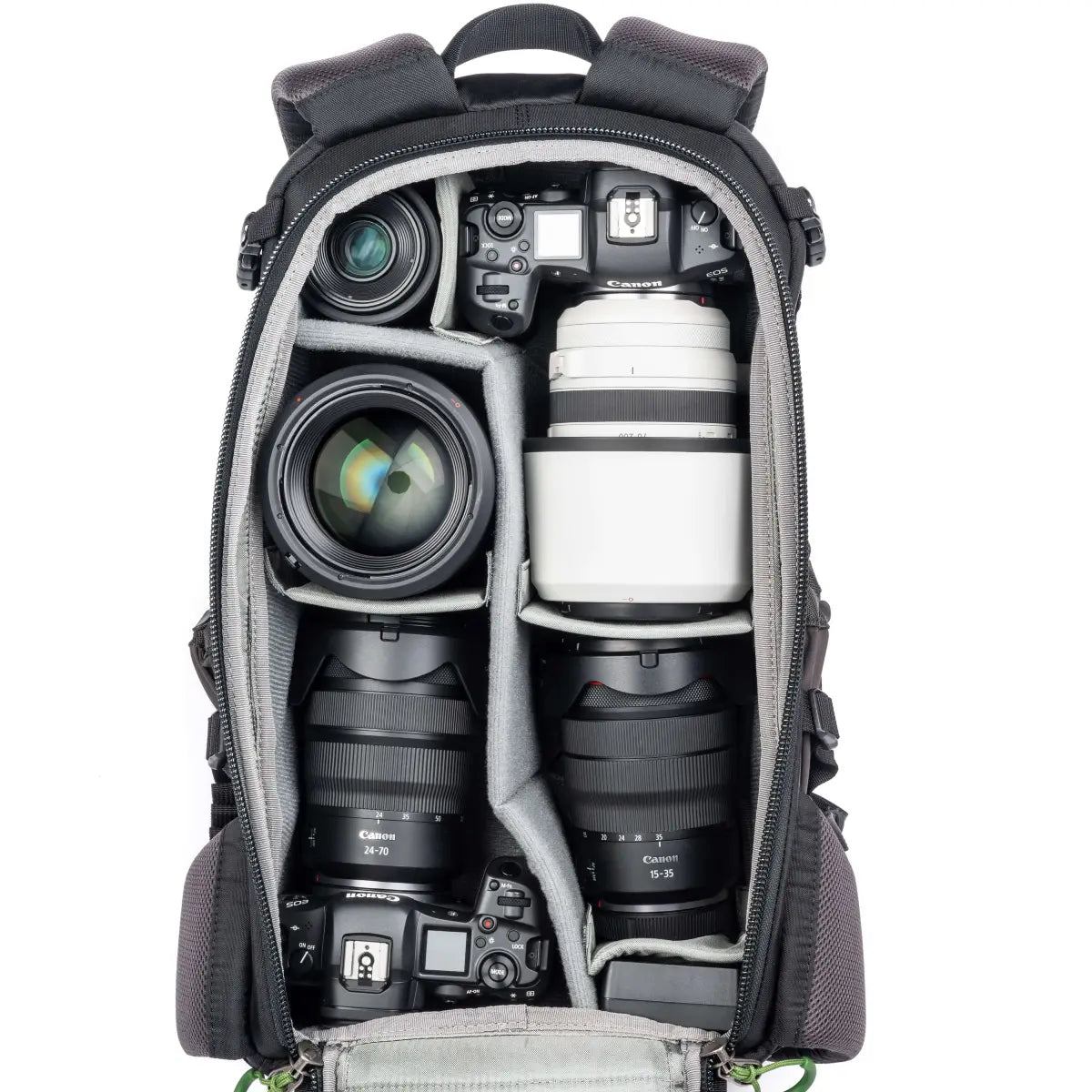 Camera backpack with camera equipment including lenses and bodies on a white background