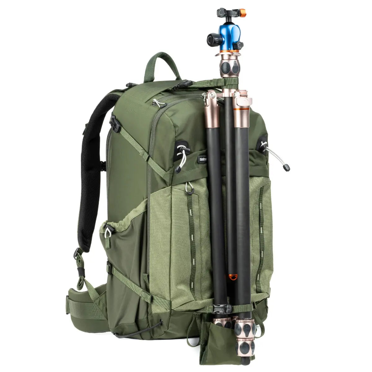 Green backpack with camera equipment on a white background