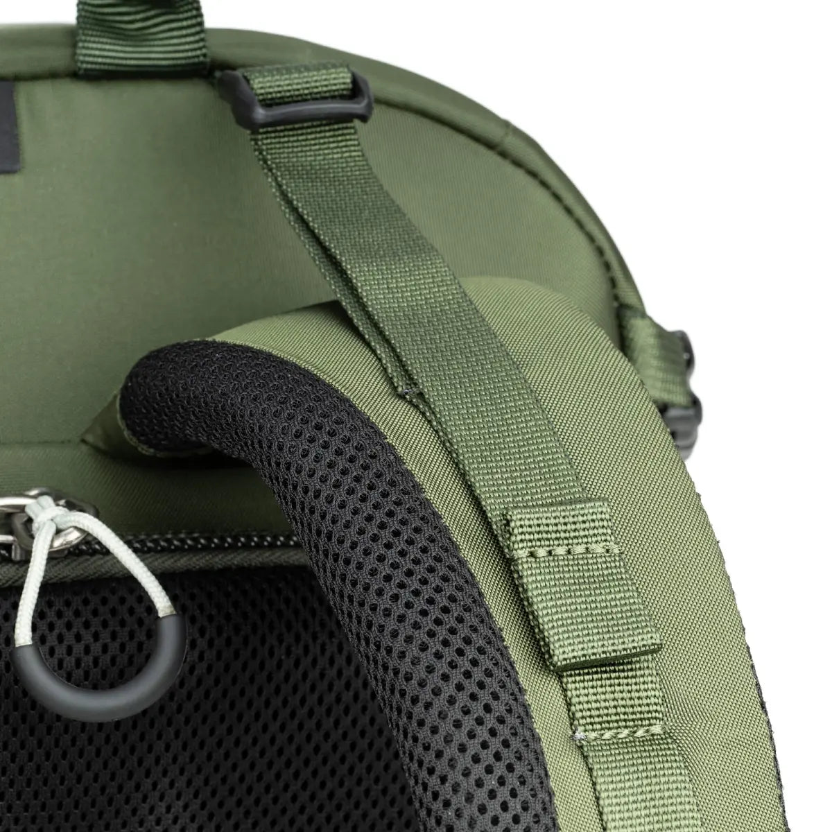 Close-up of a green backpack with a shoulder strap and carrying handle on a white background