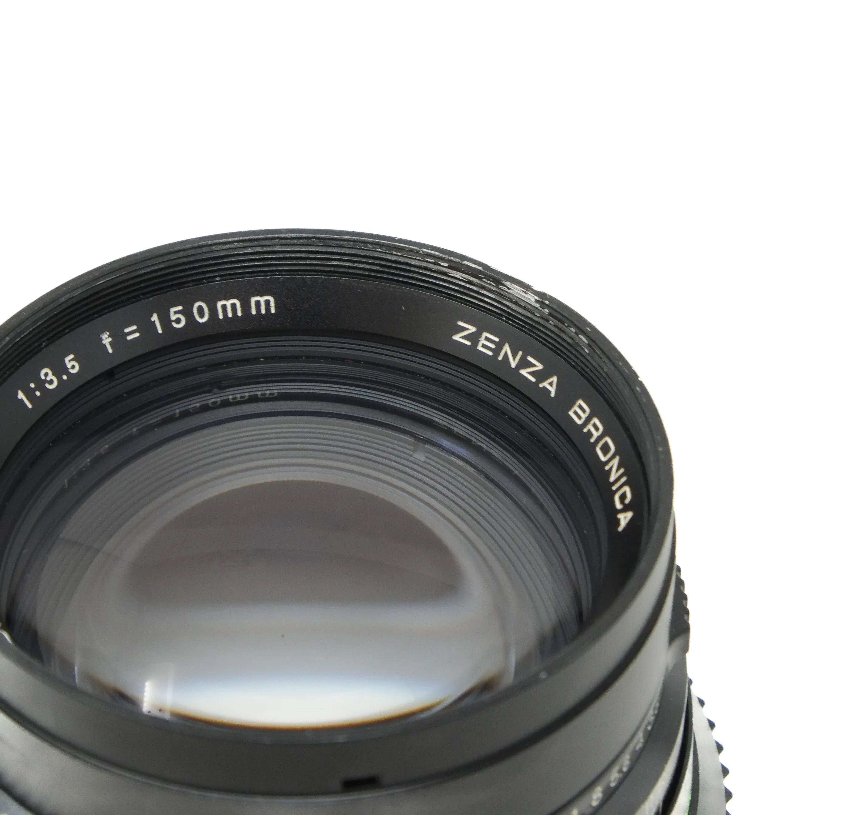 Camera lens with 'Zenza Bronica' branding on a white background