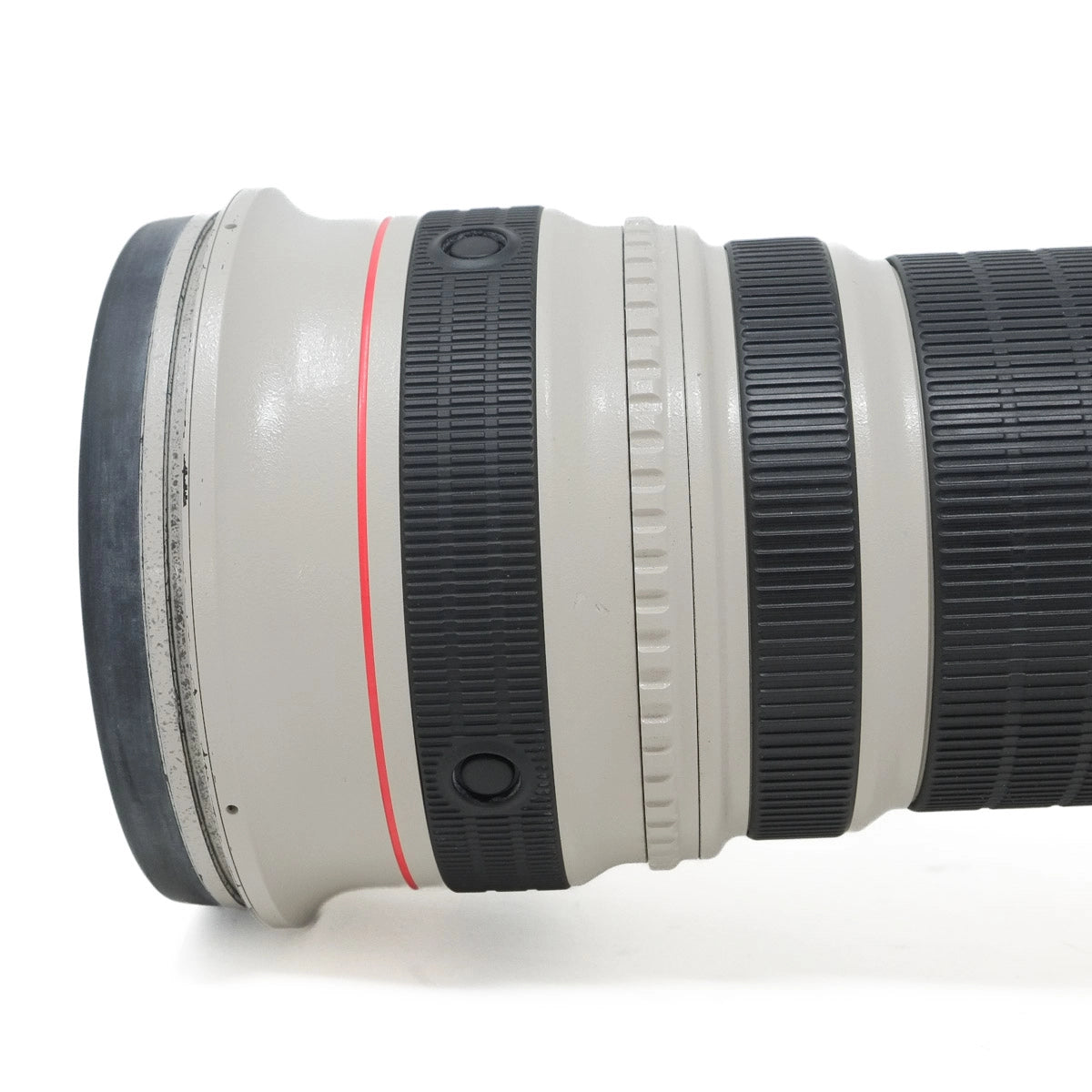 Camera lens with Canon branding on a white background