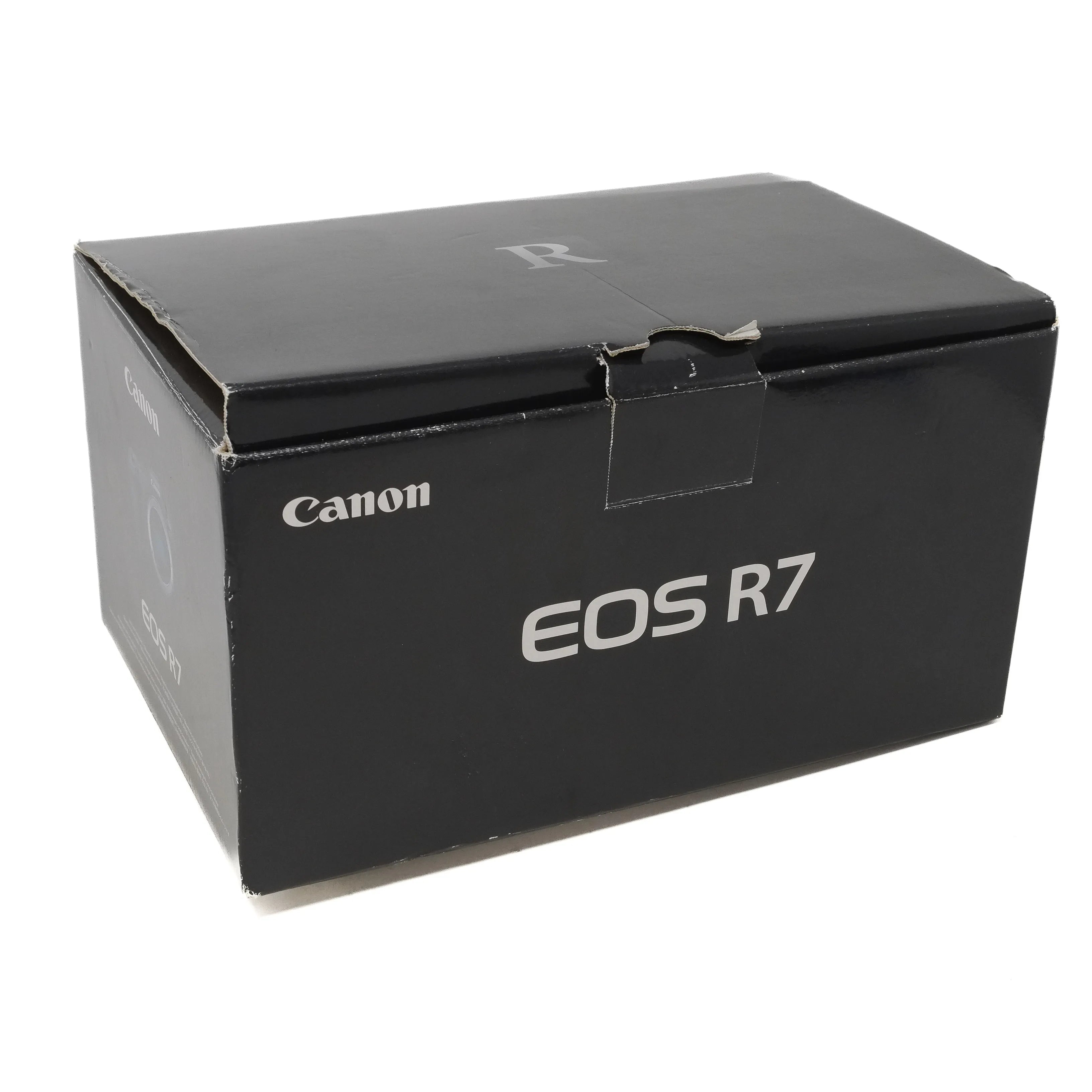 Black Canon EOS R7 camera box on a white background