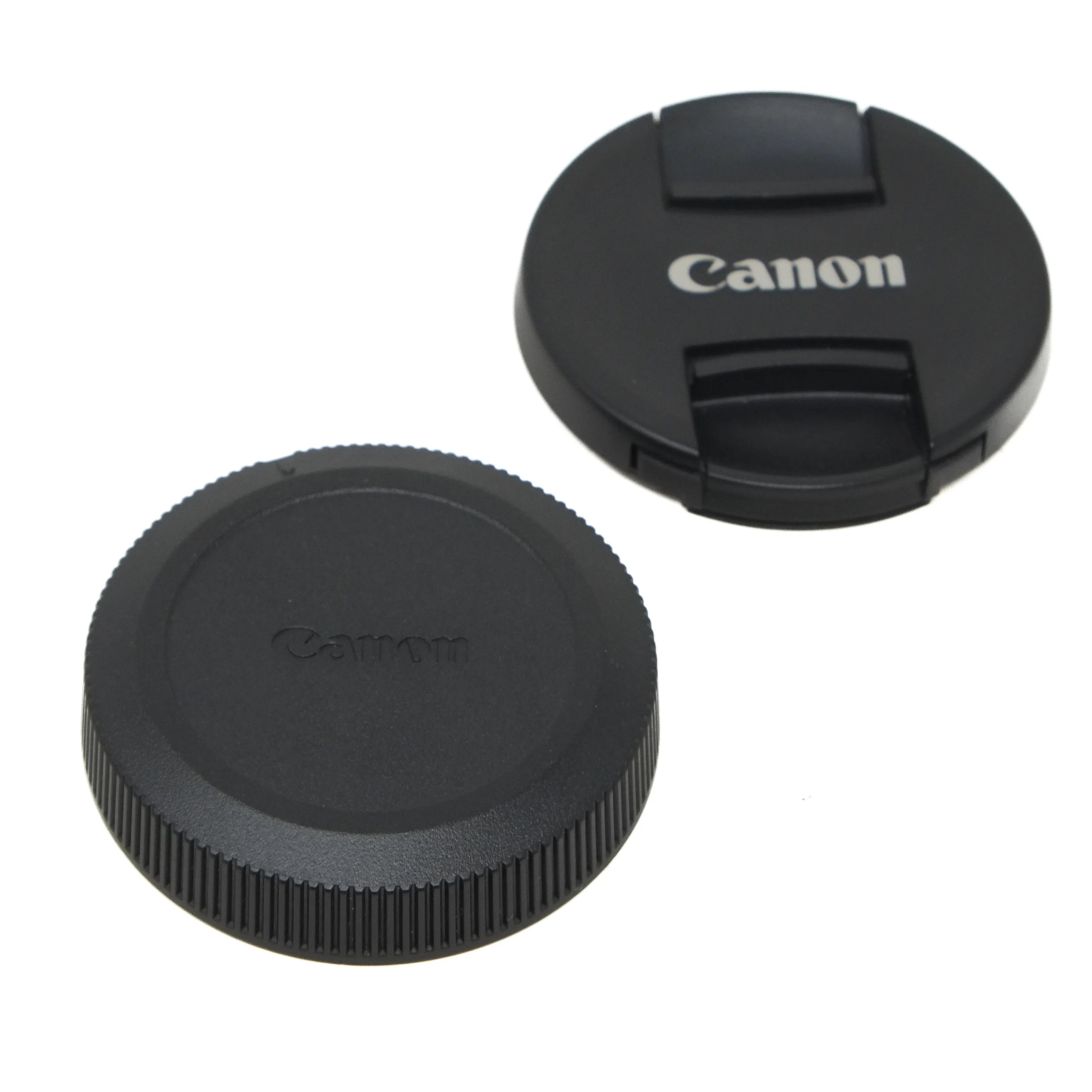 Canon camera lens caps on a white background