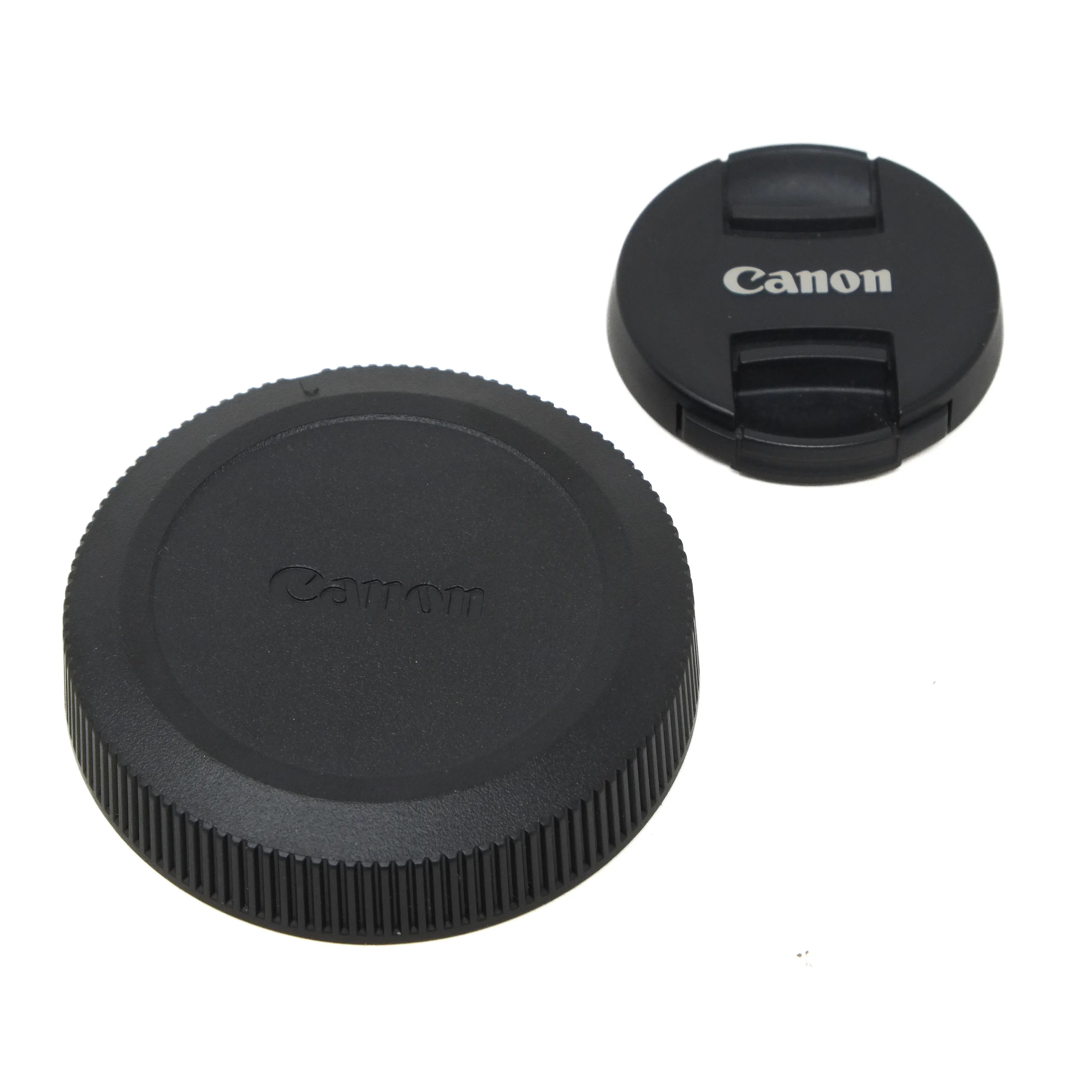 Canon camera lens cap and rear cap on a white background