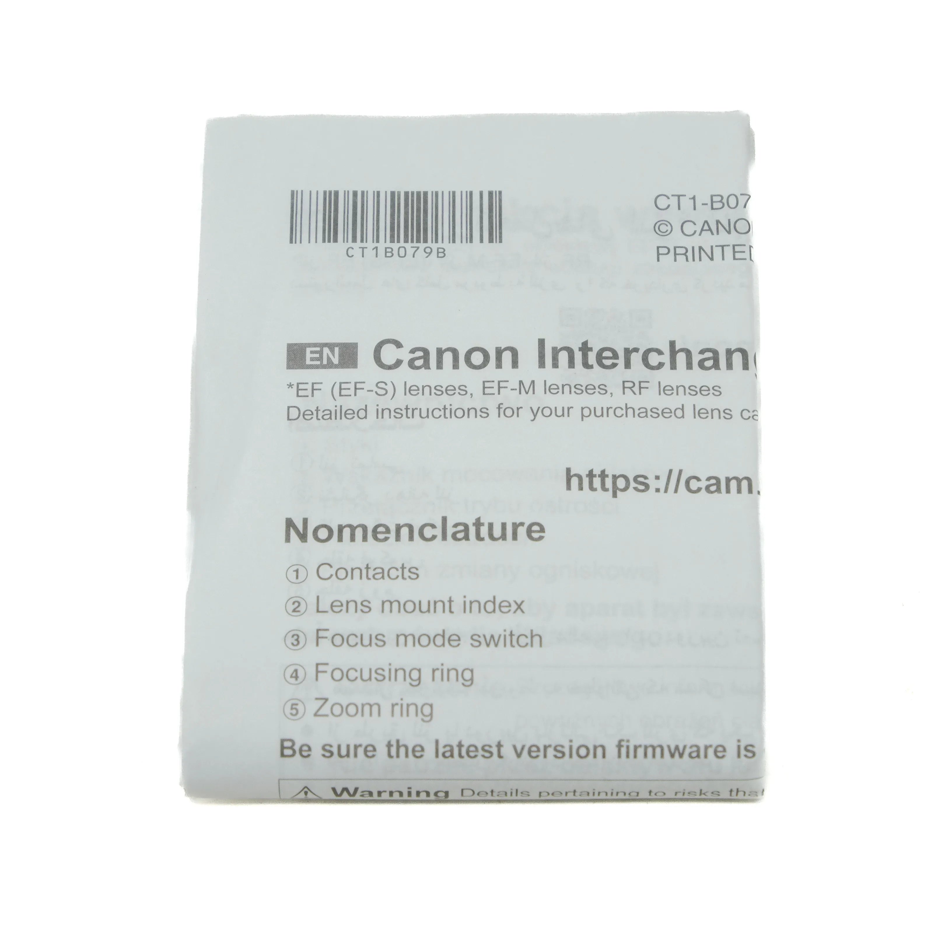 Canon interchangeable lens manual with text and barcode on a white background