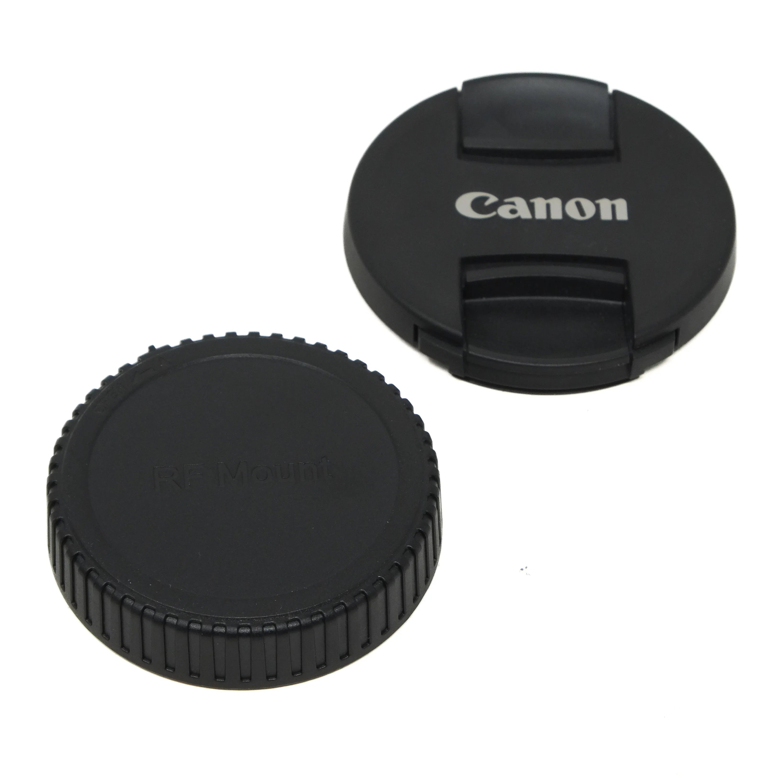 Two black camera lens caps, one with Canon logo, on a white background