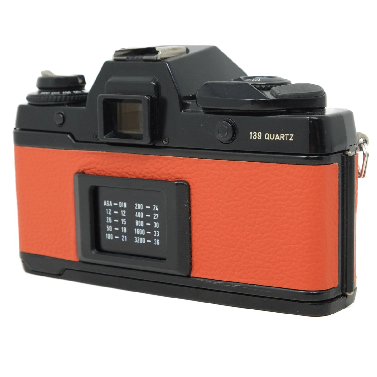 Film camera with orange body and black accents on a white background