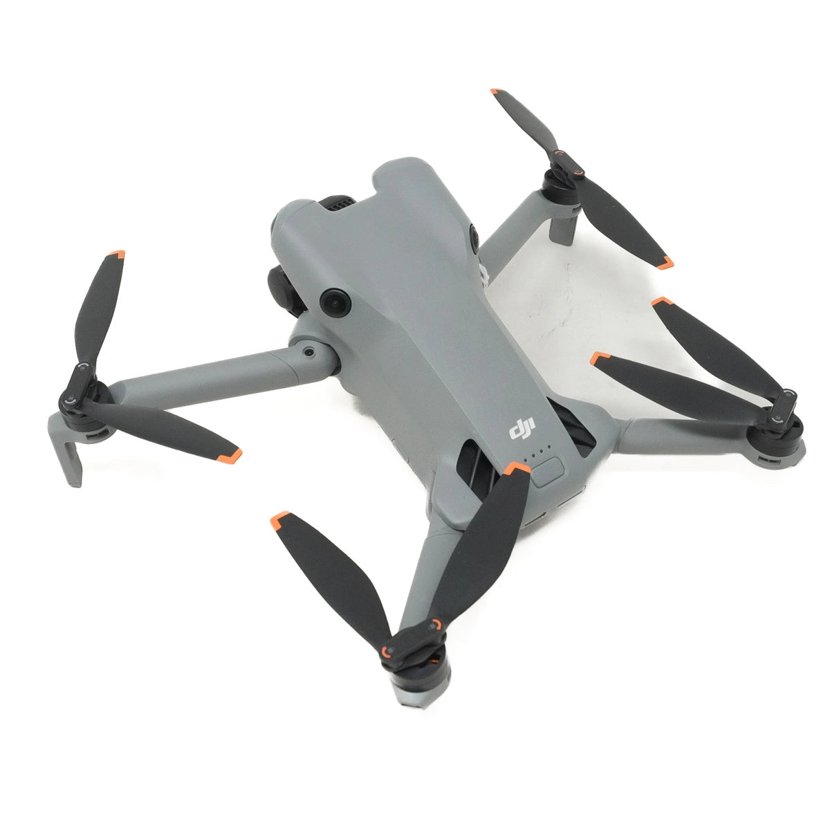 Gray drone with black propellers on a white background