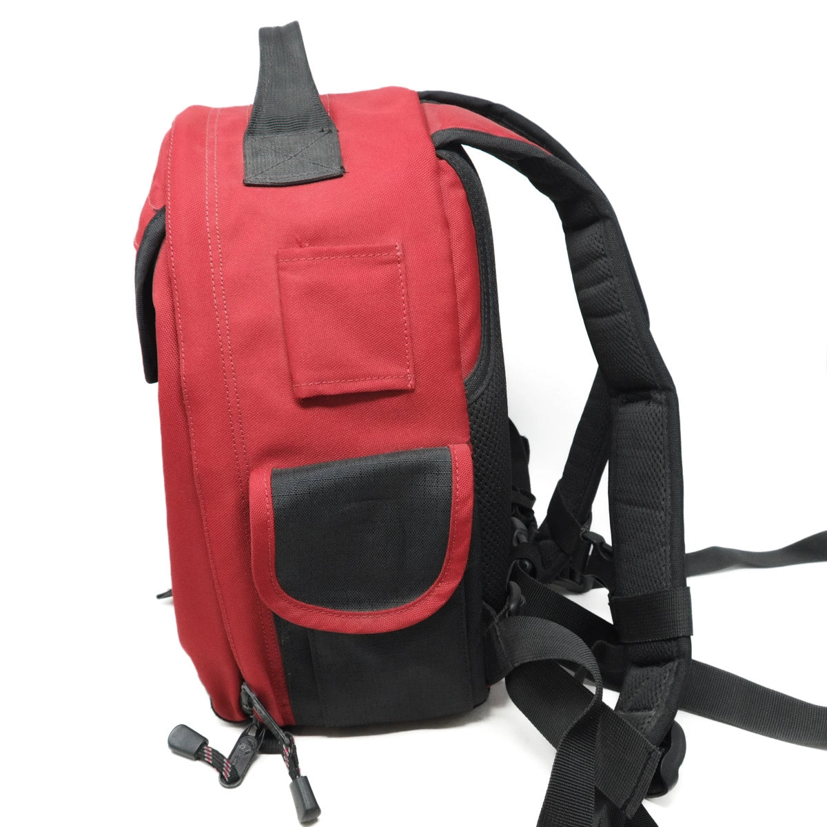 Red and black backpack on a white background