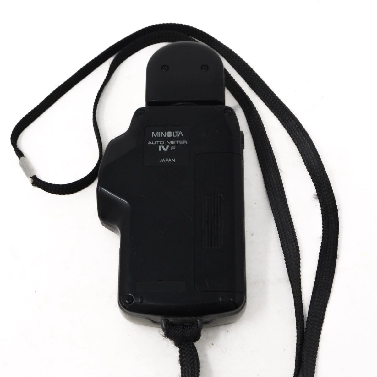 Black Minolta auto meter IVF on a white background