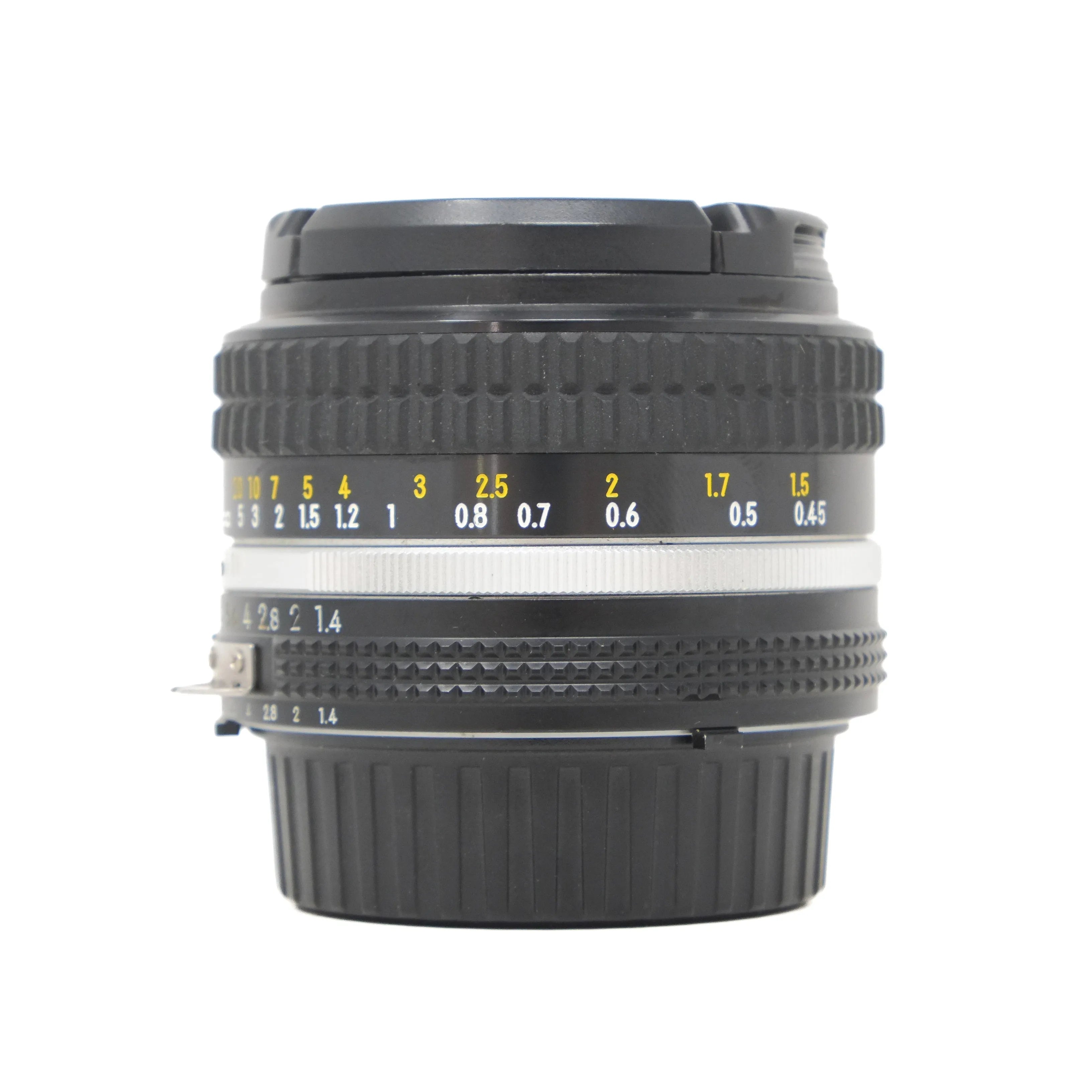 Camera lens with focus scale on a white background