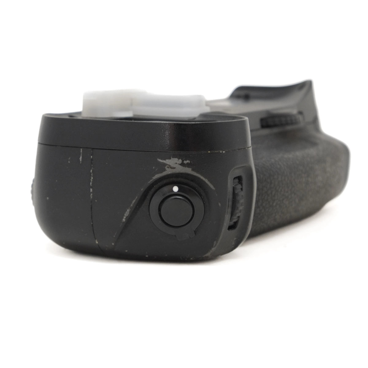 Black camera battery grip on a white background