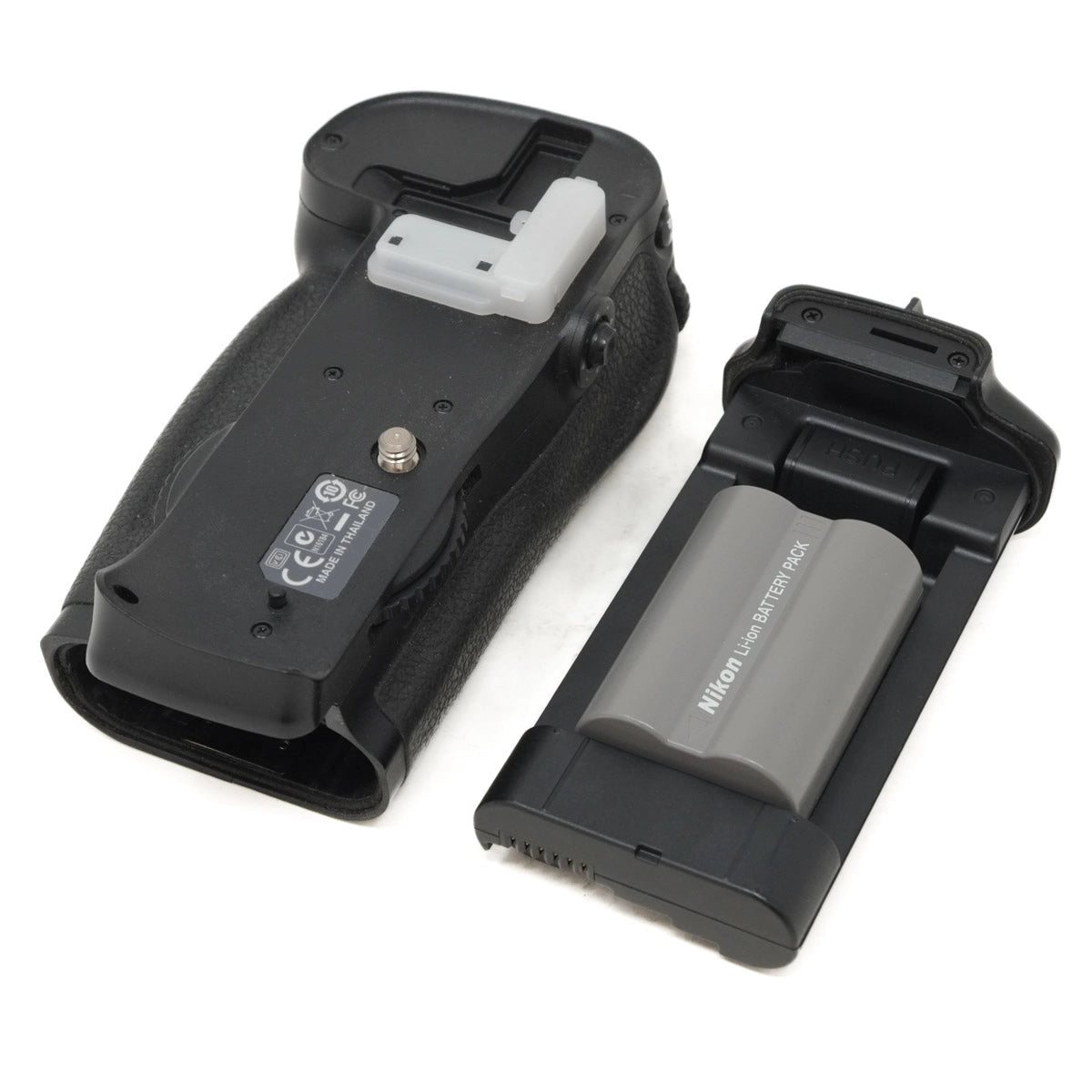 Camera battery grip and battery on a white background