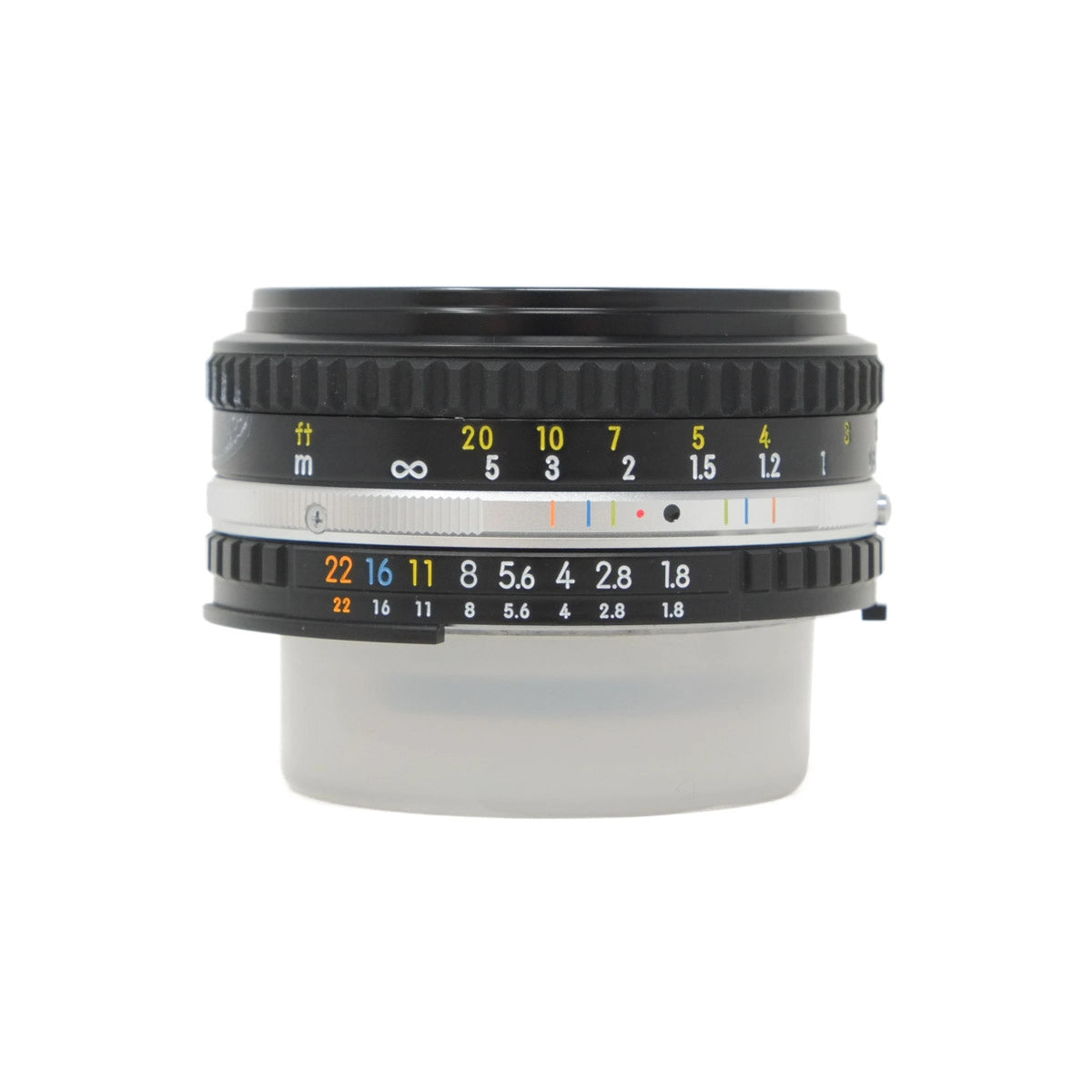 Camera lens with focus and aperture scale on a white background