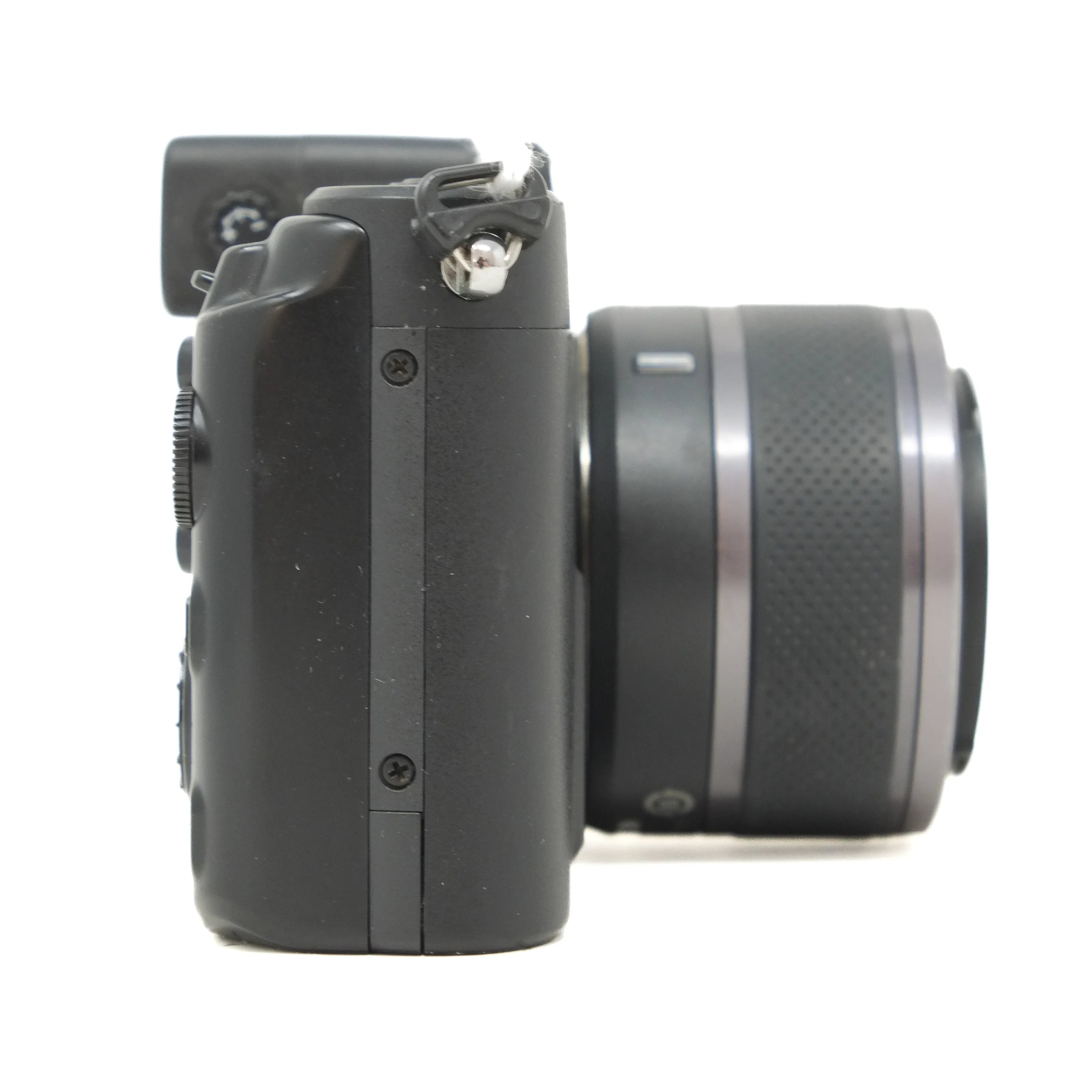 Black camera with lens on a white background