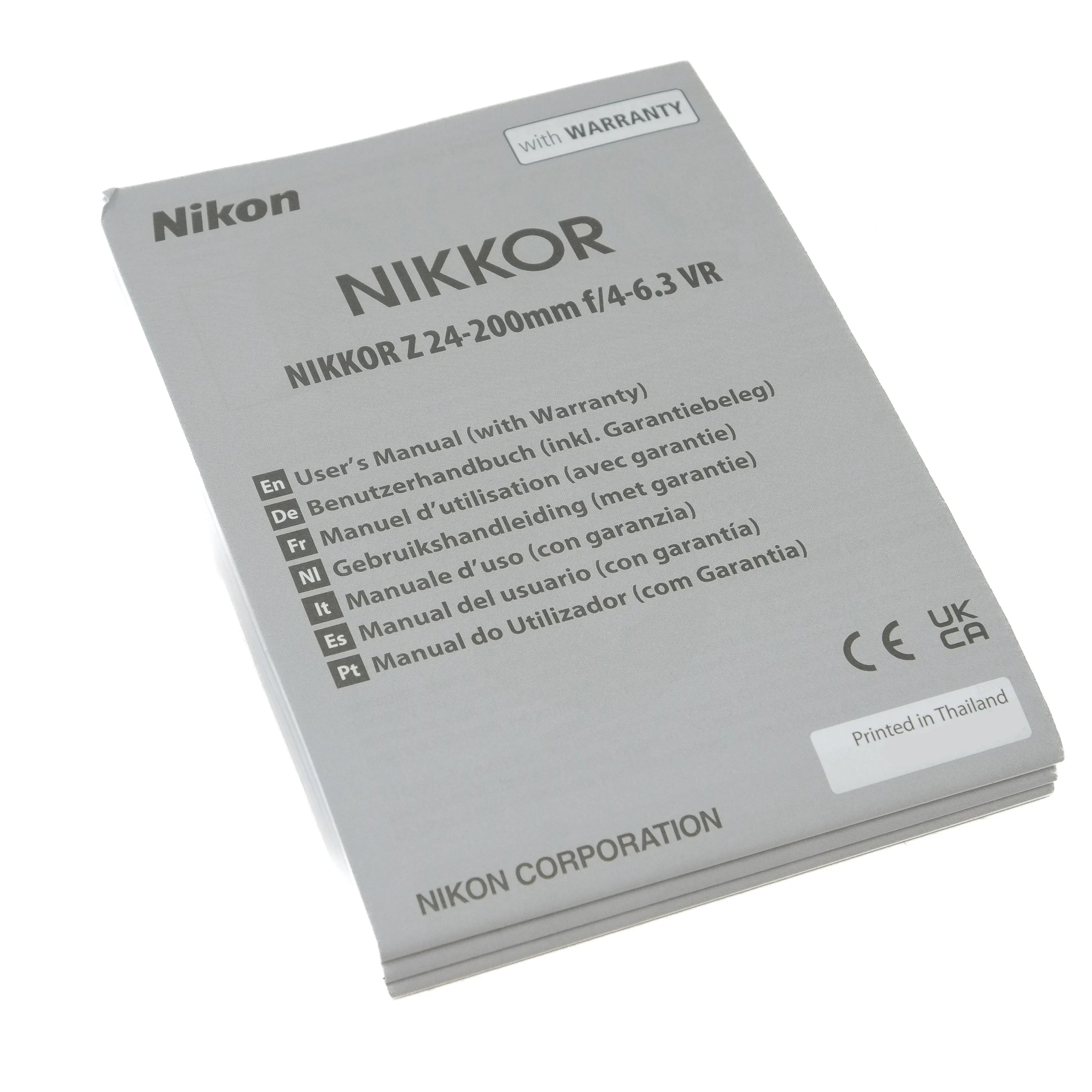 Nikon Nikkor camera lens user manual on a white background