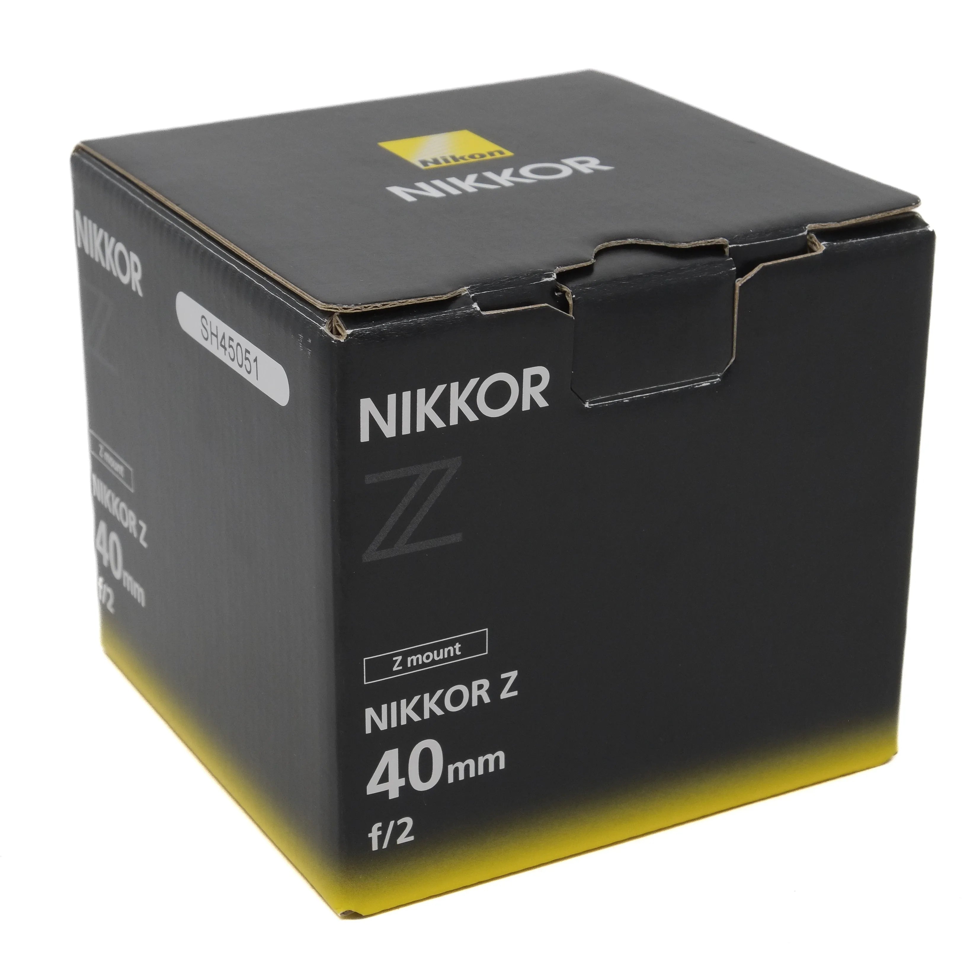 Nikkor camera lens packaging box on a white background
