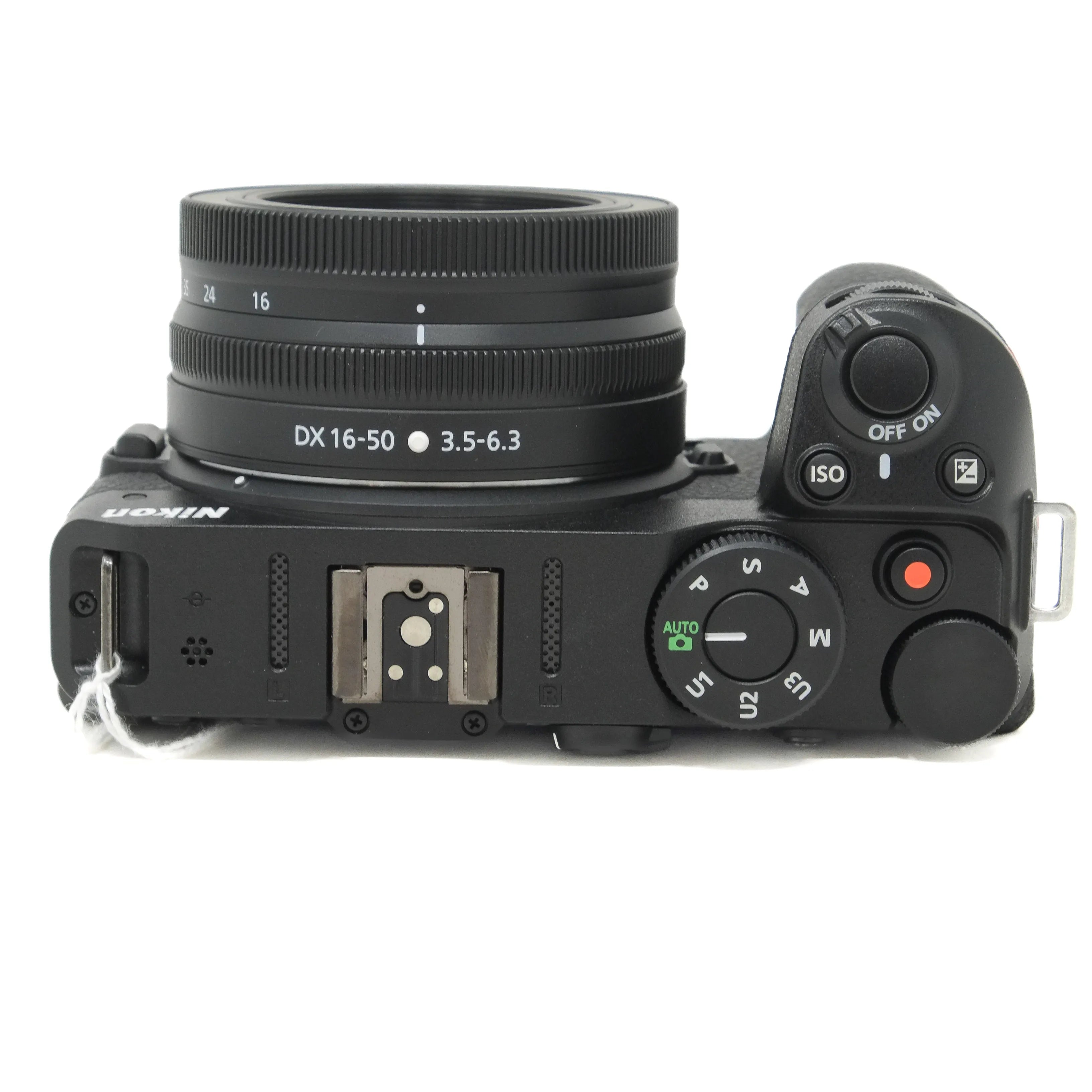 Nikon camera body with lens on a white background