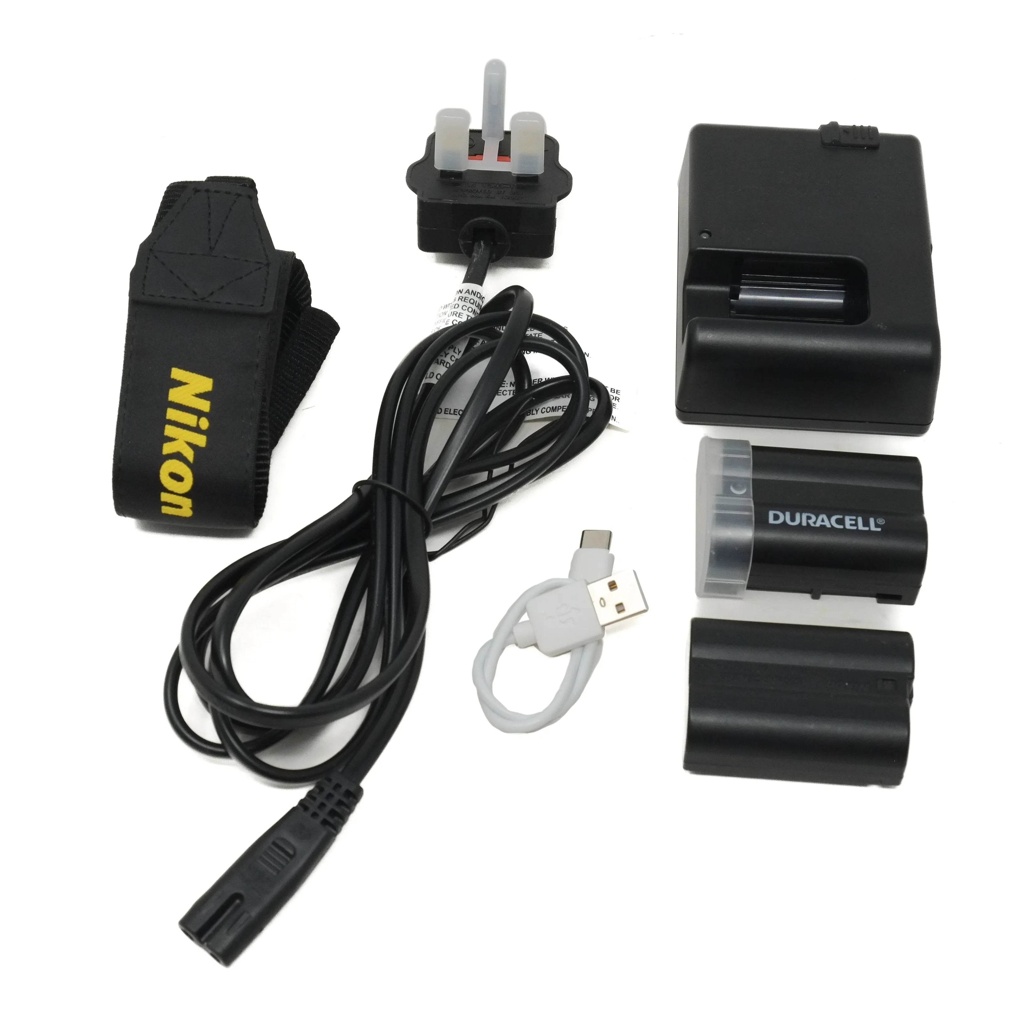 Collection of Nikon and Duracell electronic components on a white background