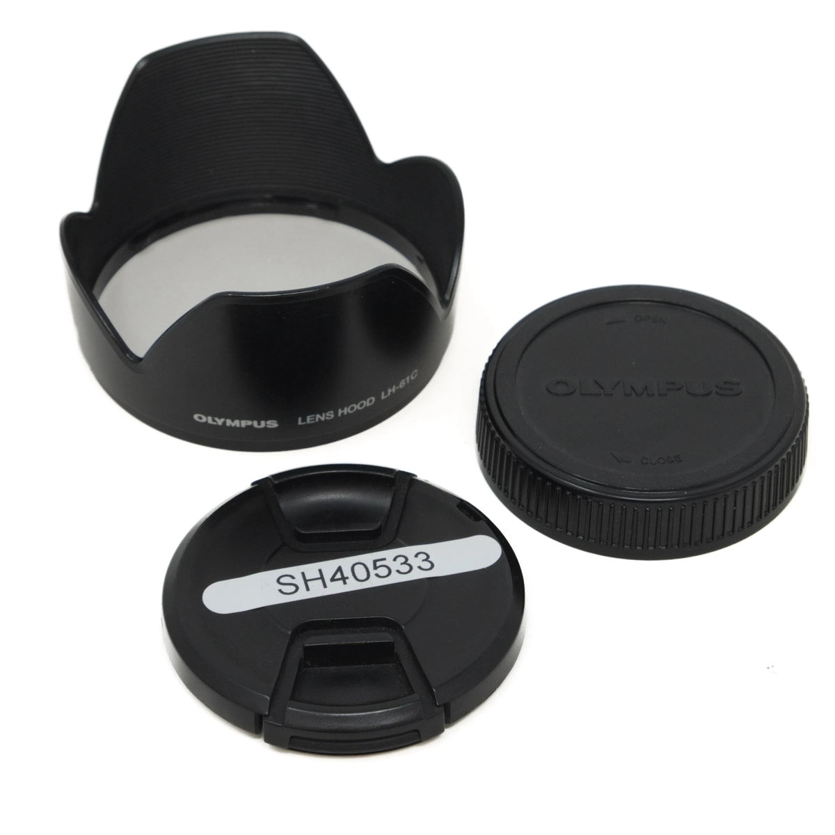 Olympus camera lens accessories including a lens hood, front cap, and rear cap on a white background.