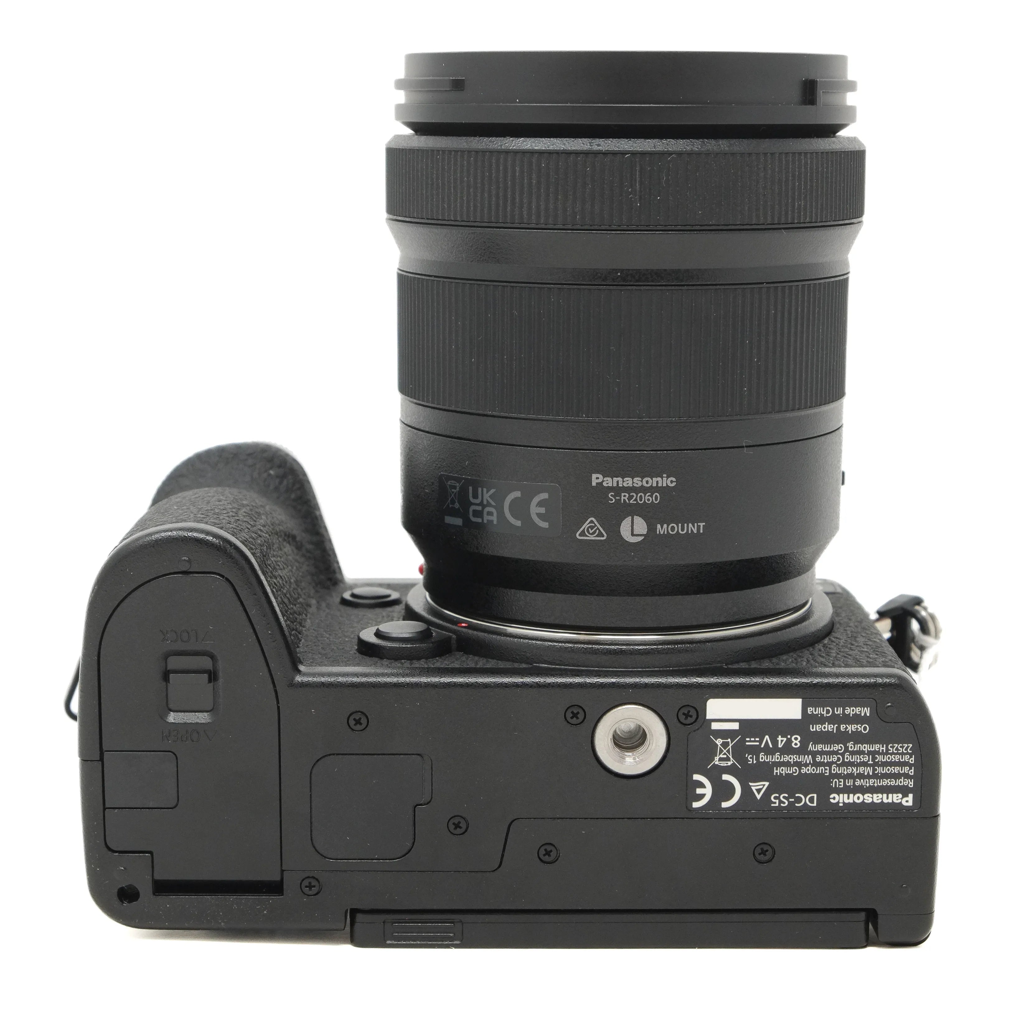 Black camera with lens on a white background