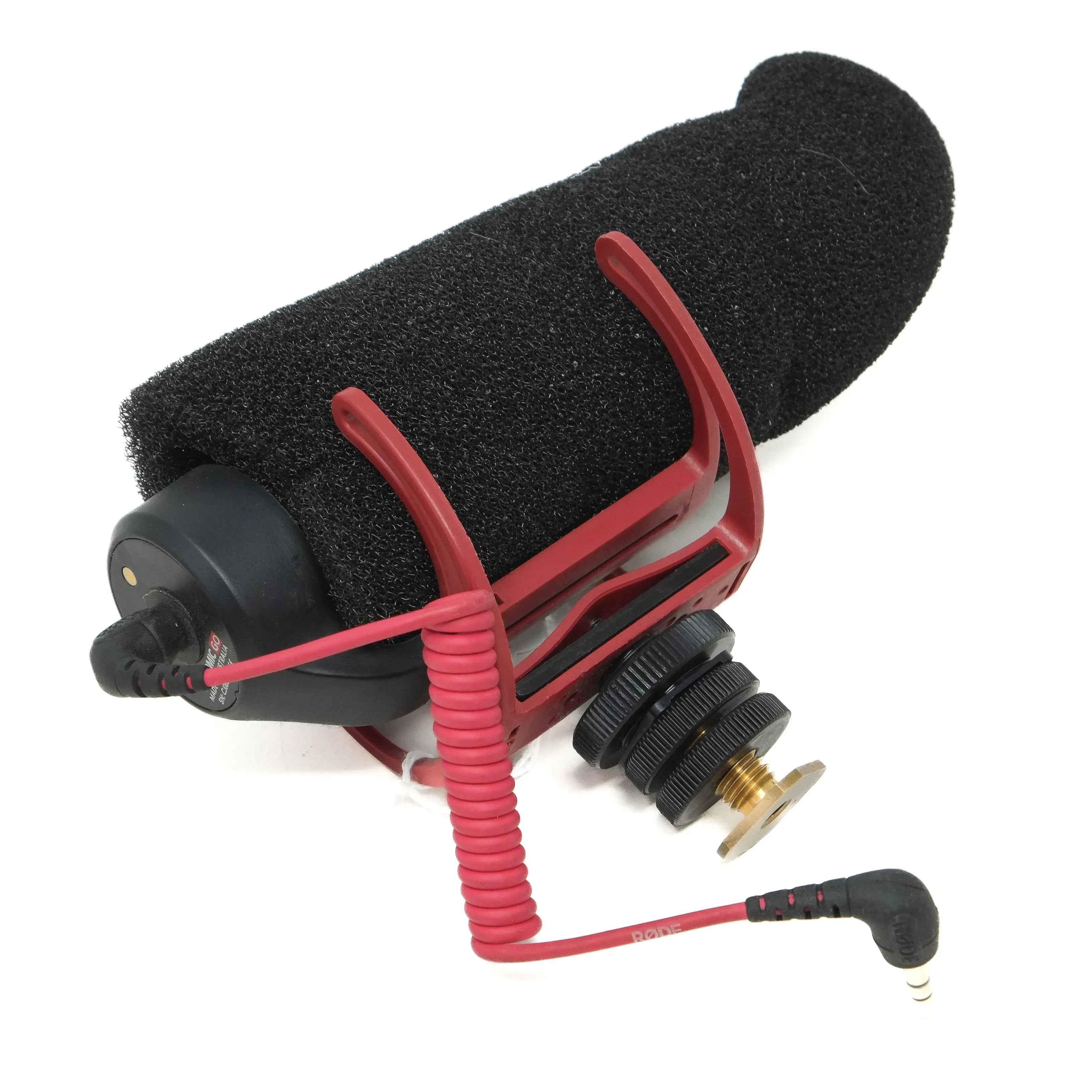 Video microphone with foam windscreen and red shock mount on a white background