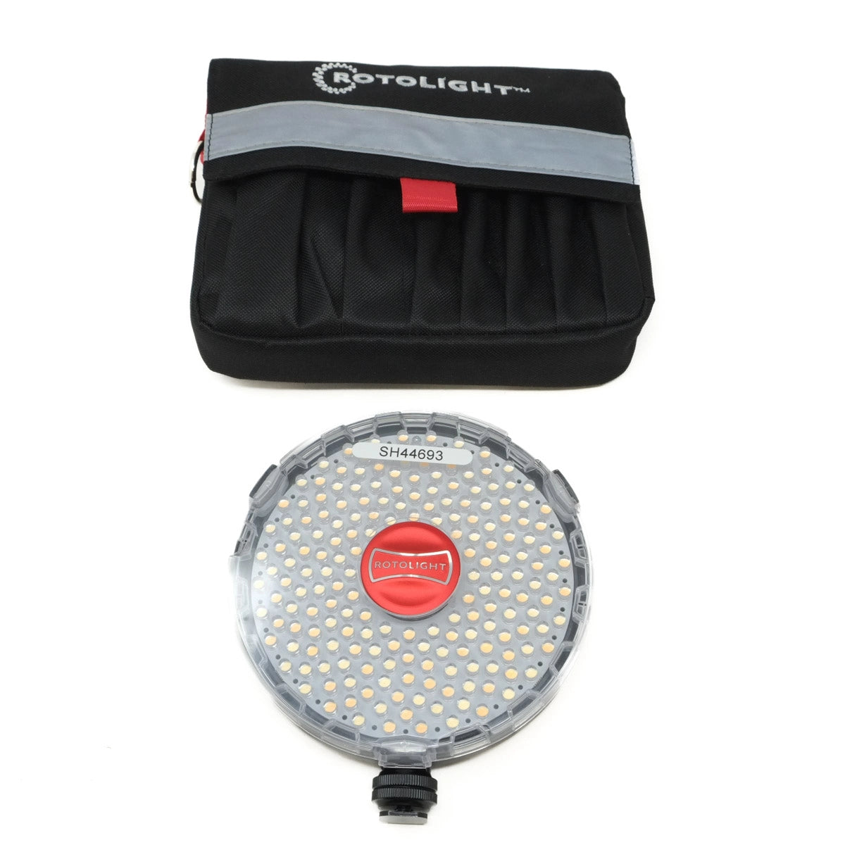 Rotolight LED light and storage case on a white background
