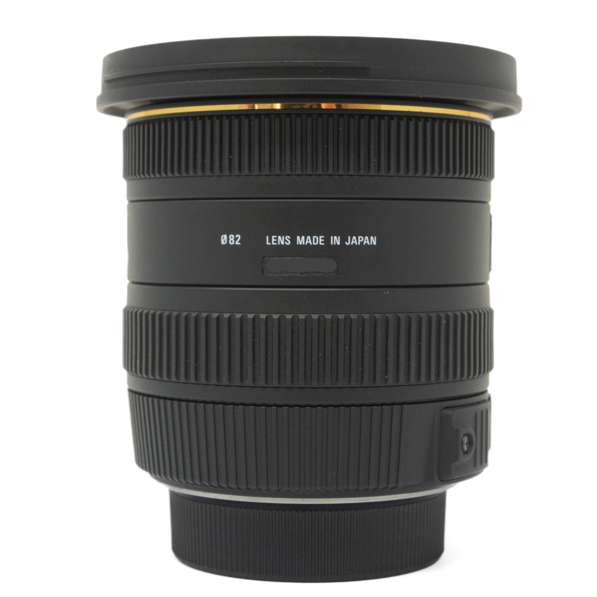 Camera lens with 'Made in Japan' text on a white background